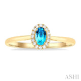 5x3 MM Oval Shape Blue Topaz and 1/20 Ctw Single Cut Diamond Halo Semi-Precious Ring in 14K Yellow Gold