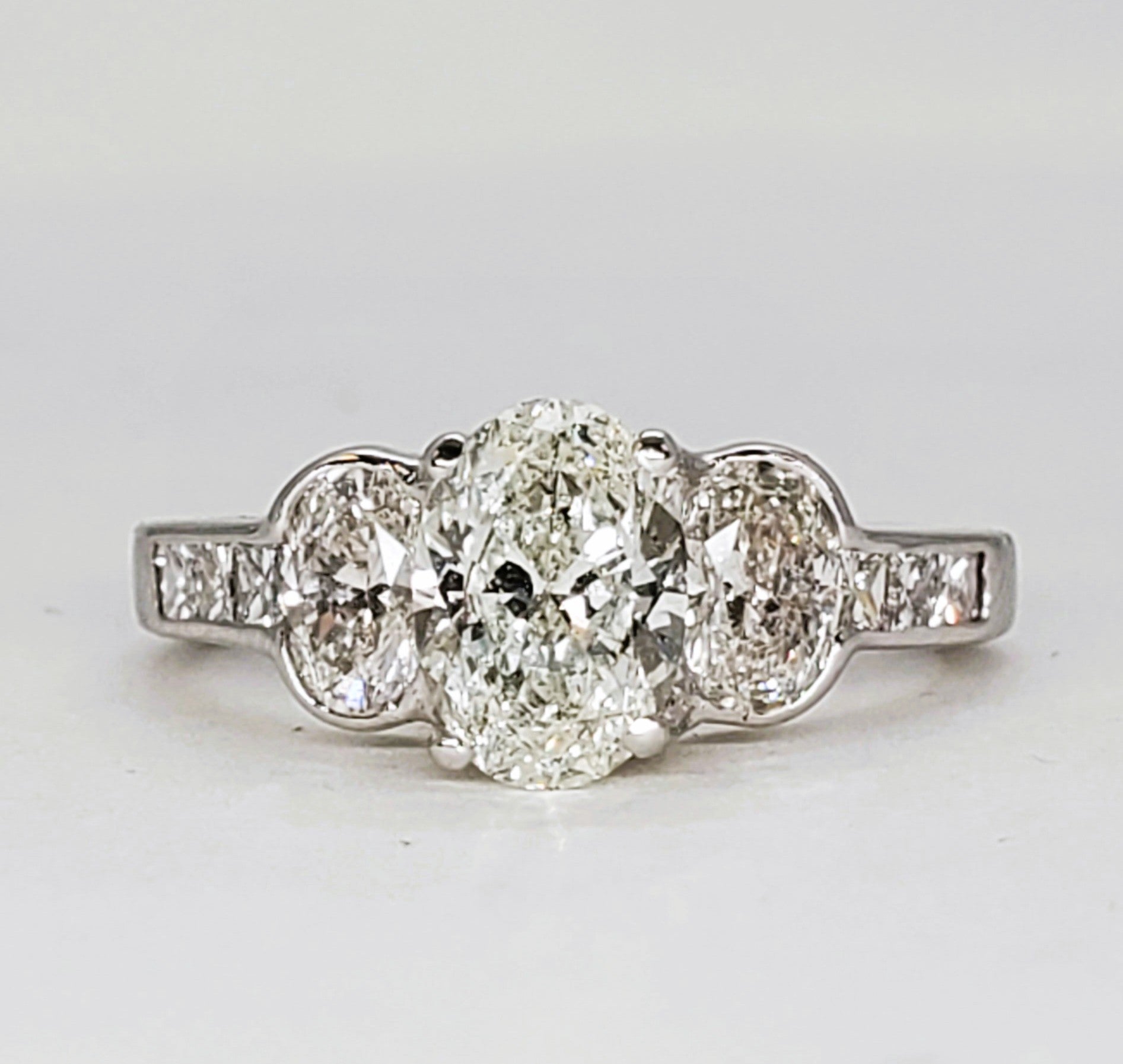 14K White Gold 2.25 Carat Three Oval Diamond Halo Ring DSR-23807