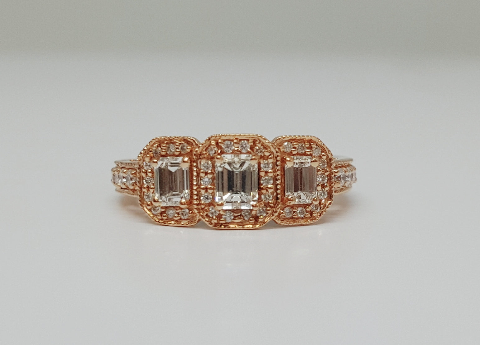 14K Rose gold 1.05 CTW Three Emerald Cut Diamond Halo Ring DFR-25790
