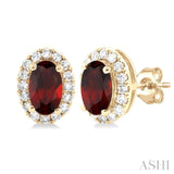 5x3 MM Oval Shape Garnet and 1/8 Ctw Single Cut Diamond Halo Semi-Precious Stud Earrings in 14K Yellow Gold