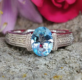 Sterling Silver Oval Blue Topaz & Diamond Ring SDM-11304