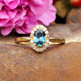 10K Yellow Gold Oval Montana Sapphire with a Diamond Halo Ring DCR-24774
