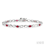 4x3 MM Oval Cut Ruby and 1/10 Ctw Round Cut Diamond Bracelet in 10K White Gold