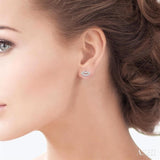 1/10 Ctw Petite Lips Round Cut Diamond Fashion Stud Earrings in 10K White Gold