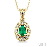 5x3mm Oval Shape Emerald and 1/20 Ctw Single Cut Diamond Pendant in 14K Yellow Gold with Chain.